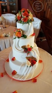 Stunning Large Wedding Cake, Orange Roses, Ivory Fondant Drapes Cascading, Fabric Draped on Wedding Cake, Autumn Colours on Wedding Cake